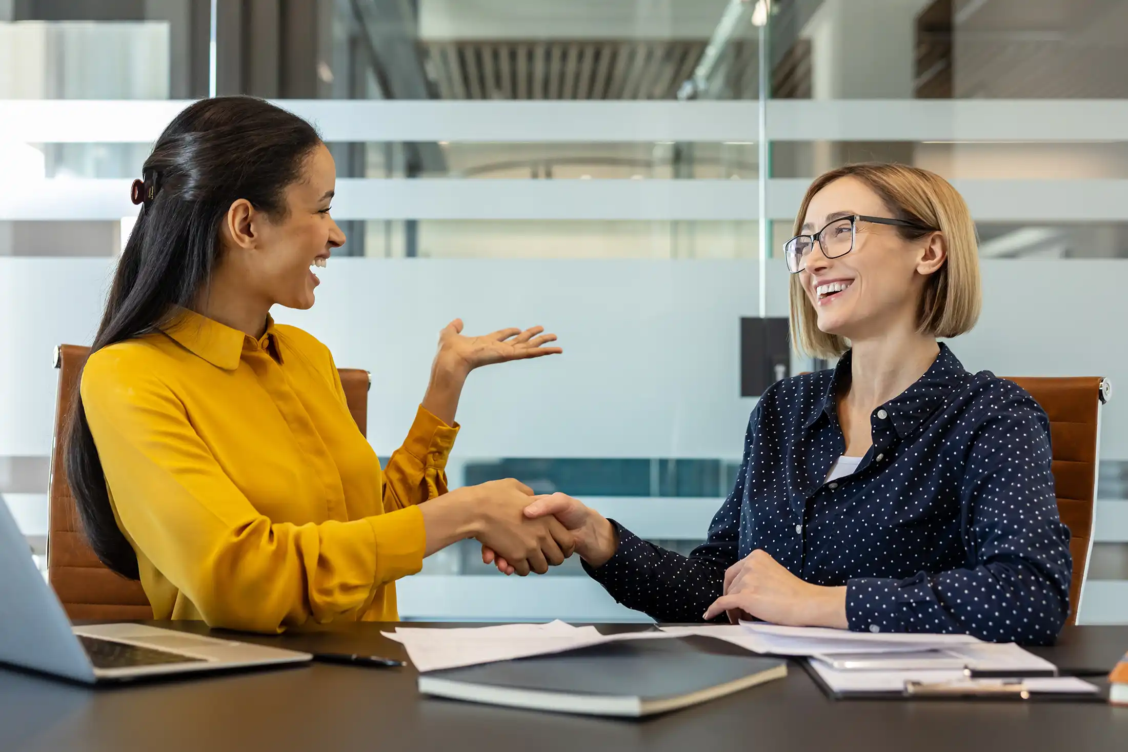 smiling and shaking hands