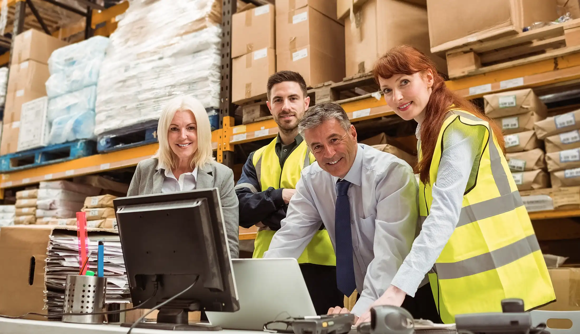 Warehouse team smiling at camera